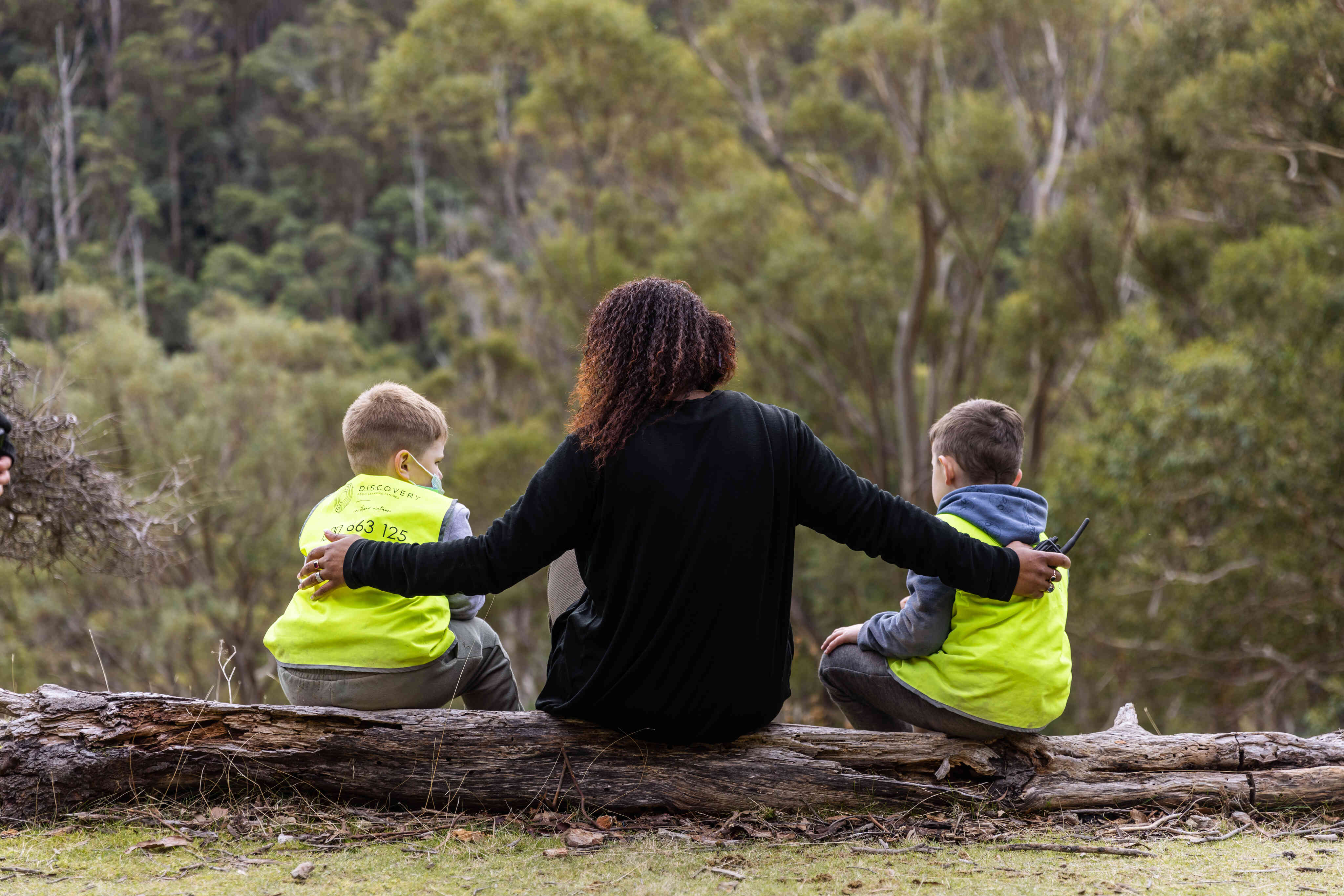 An educator comforts children