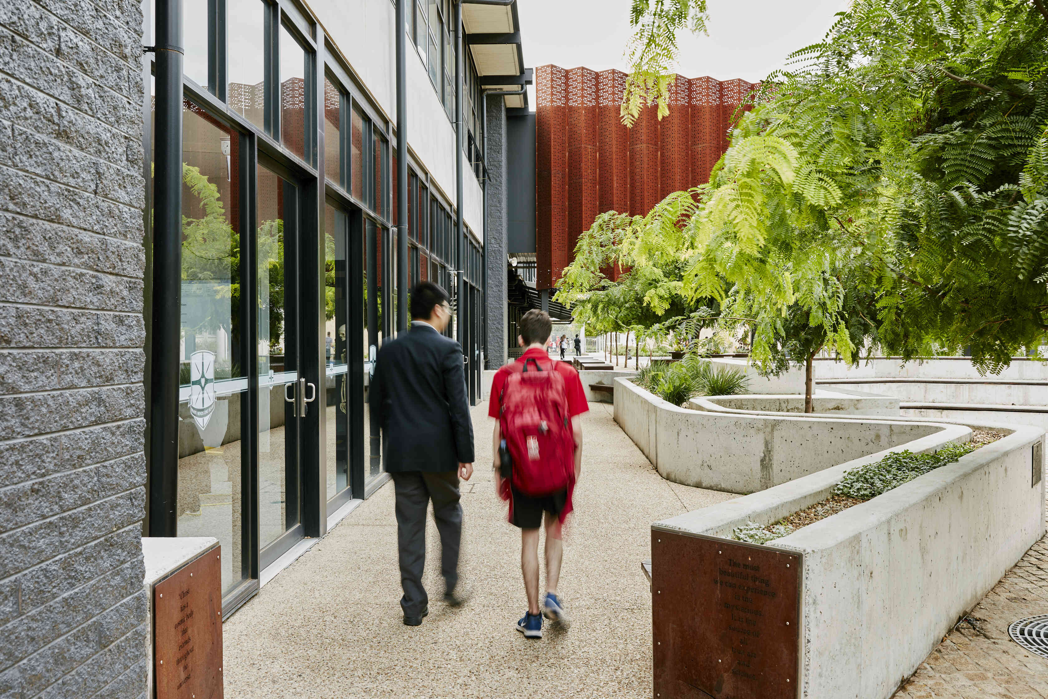 An educator walks with a student