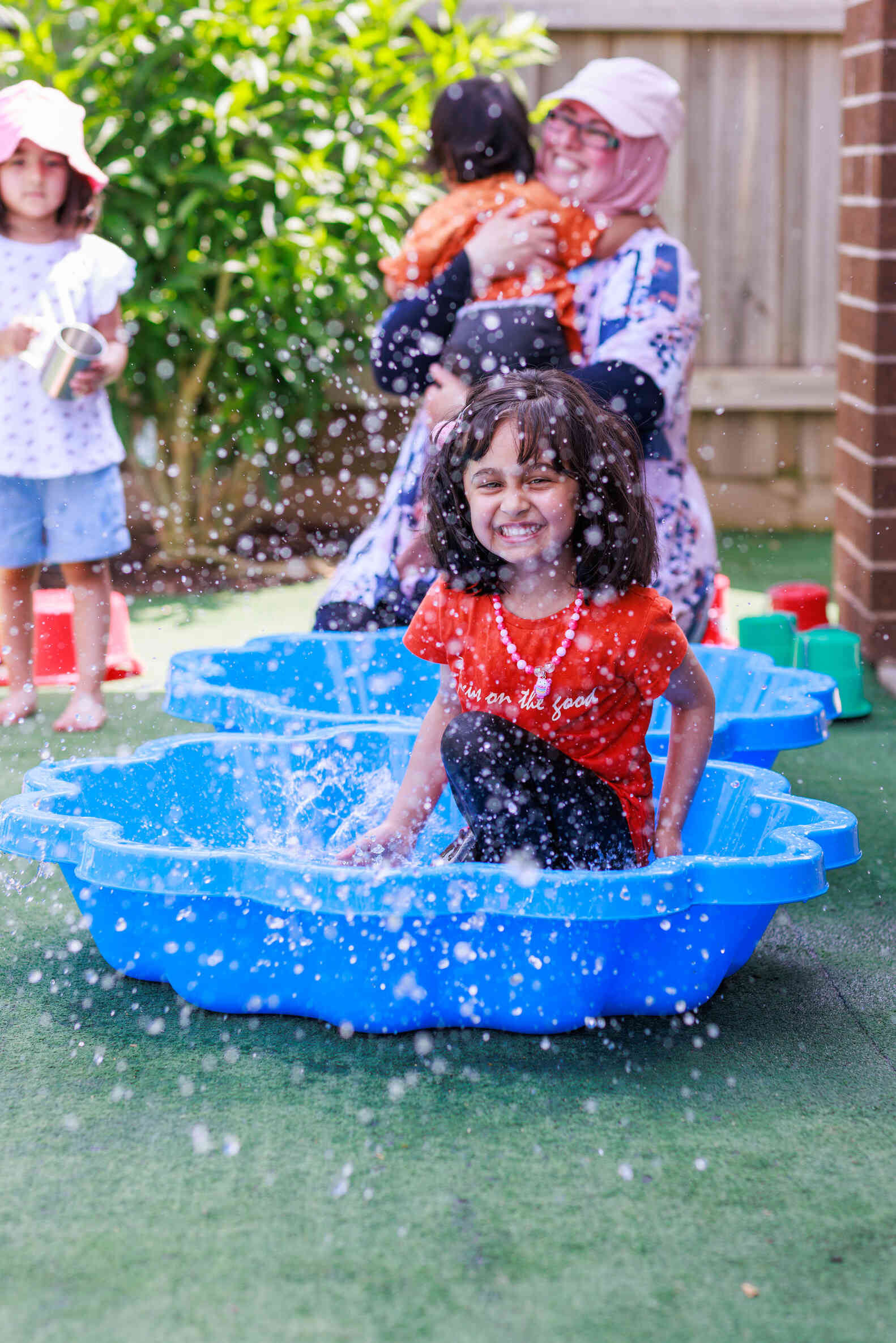 A child plays in a pool