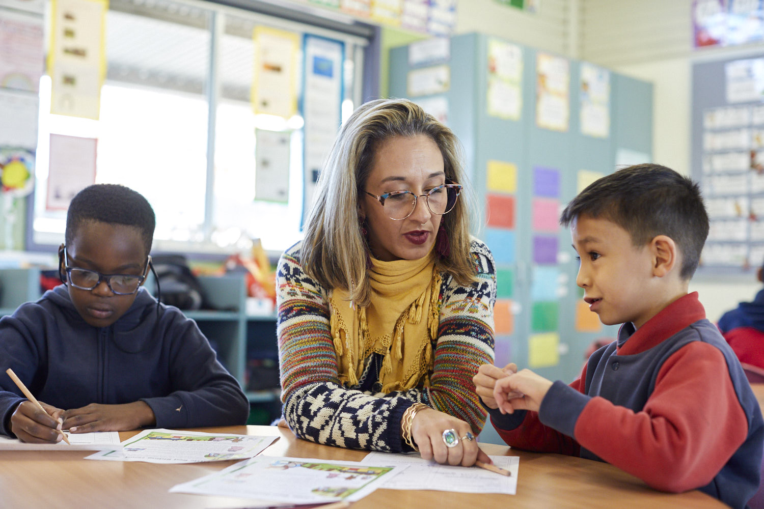 Educator working with primary school students