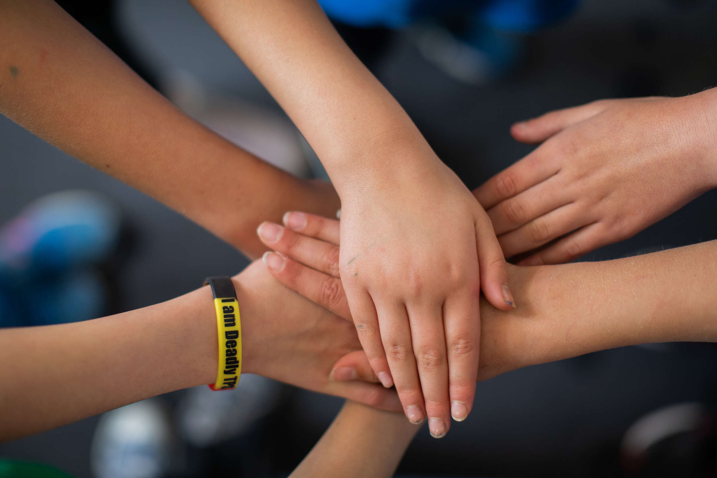 Children together linking hands 