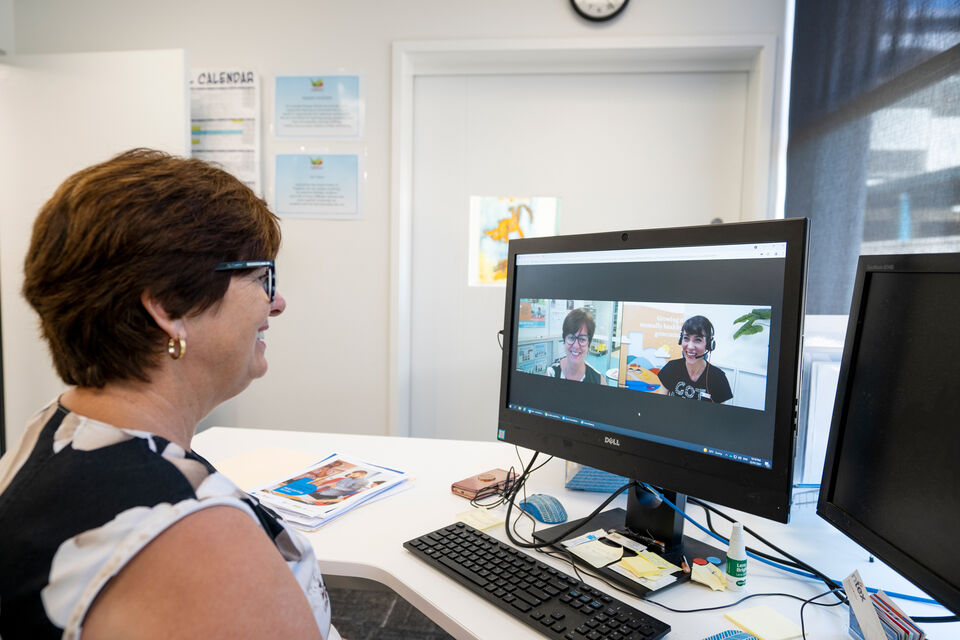 An adult working at a computer