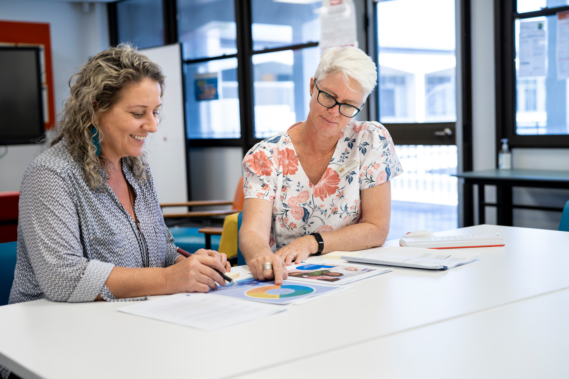 Two educators working together at a desk