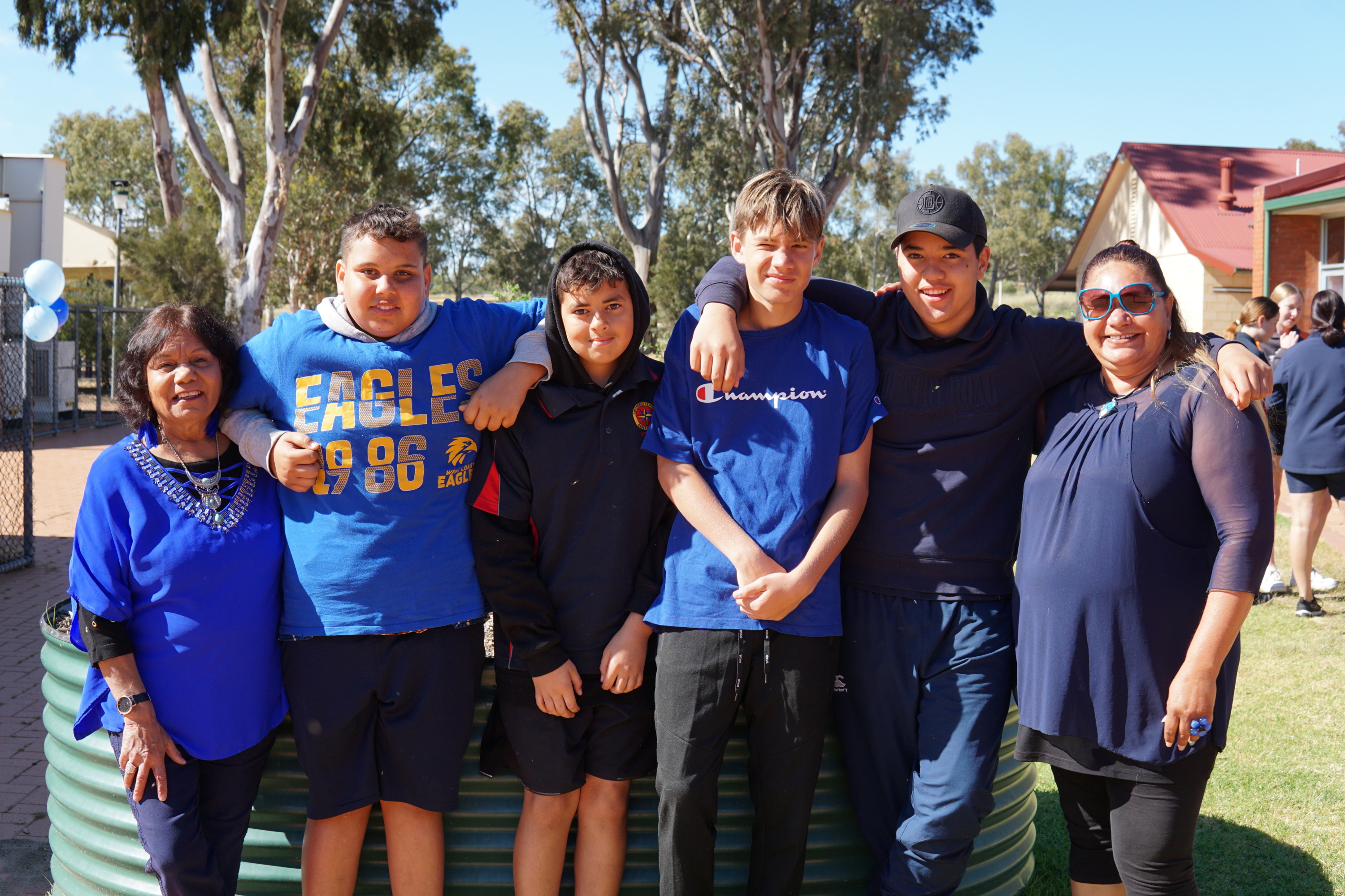 Students and teachers on a playing field