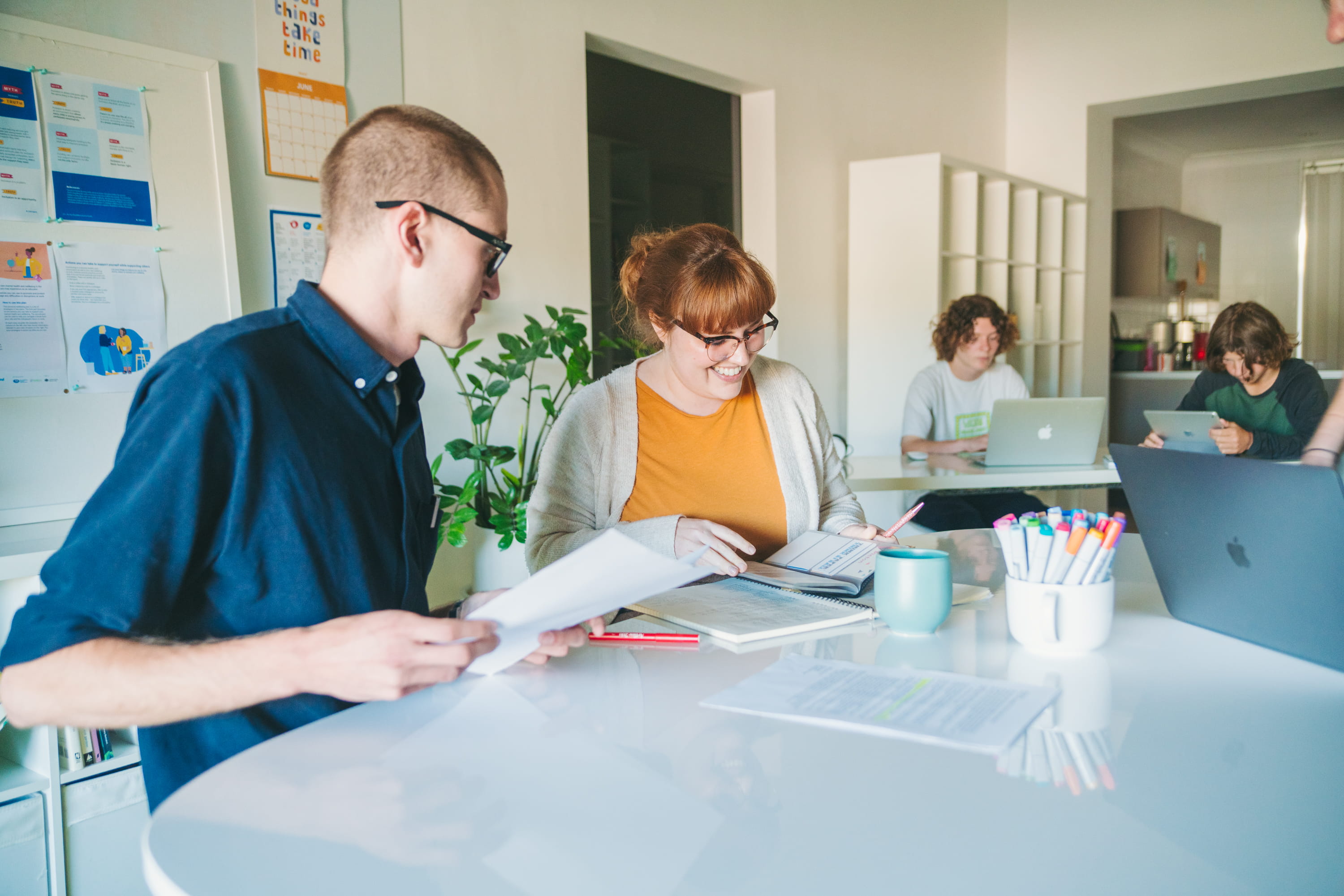 Two educators working together at a desk