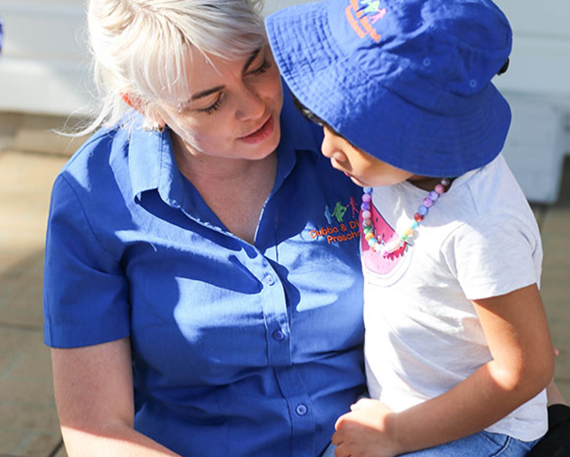 An educator with a young child