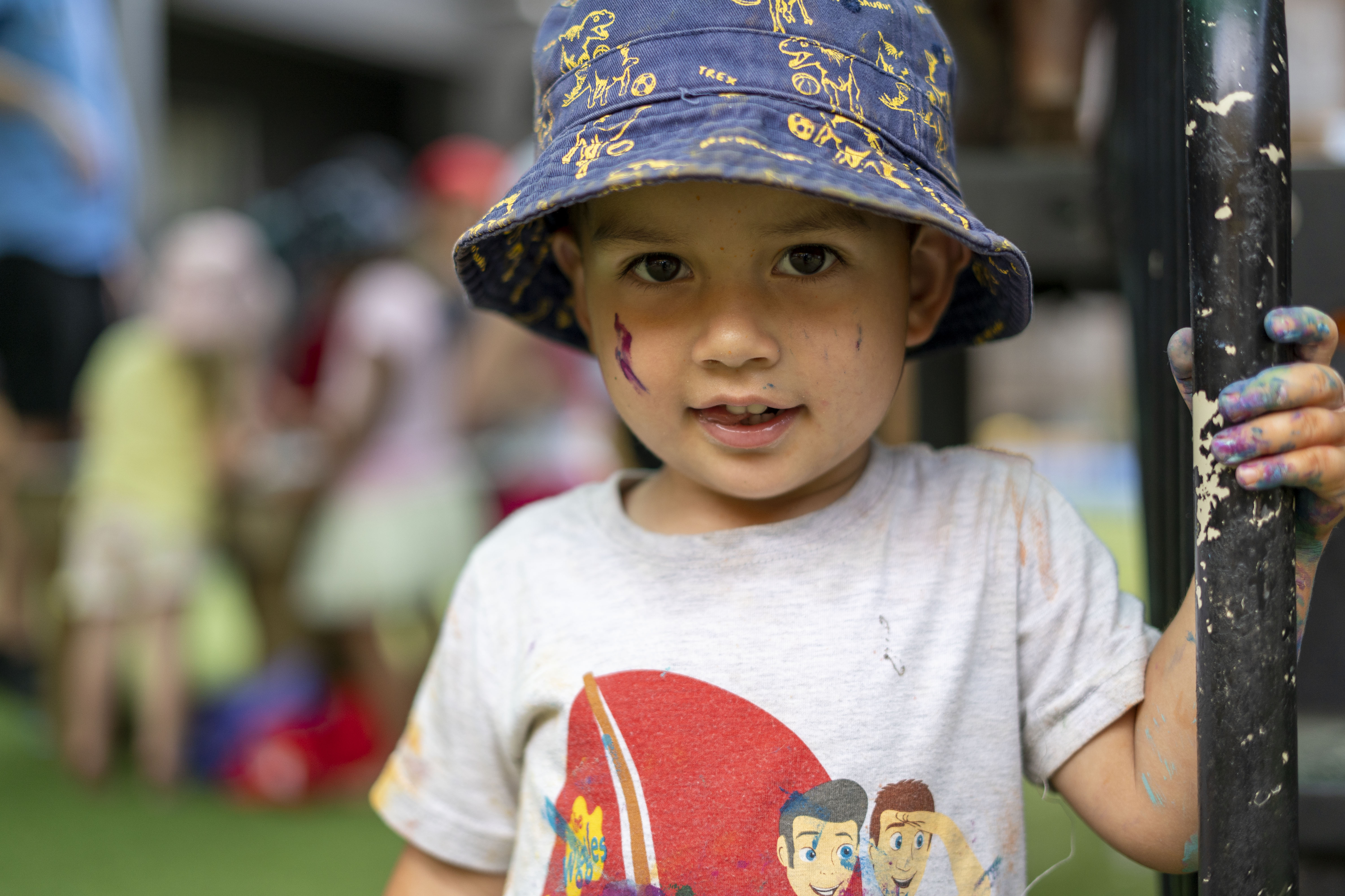 A young child, smiling at the camera 