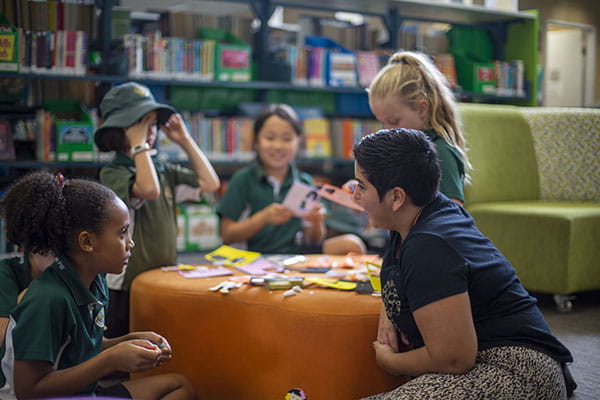 A group of children working together in a library