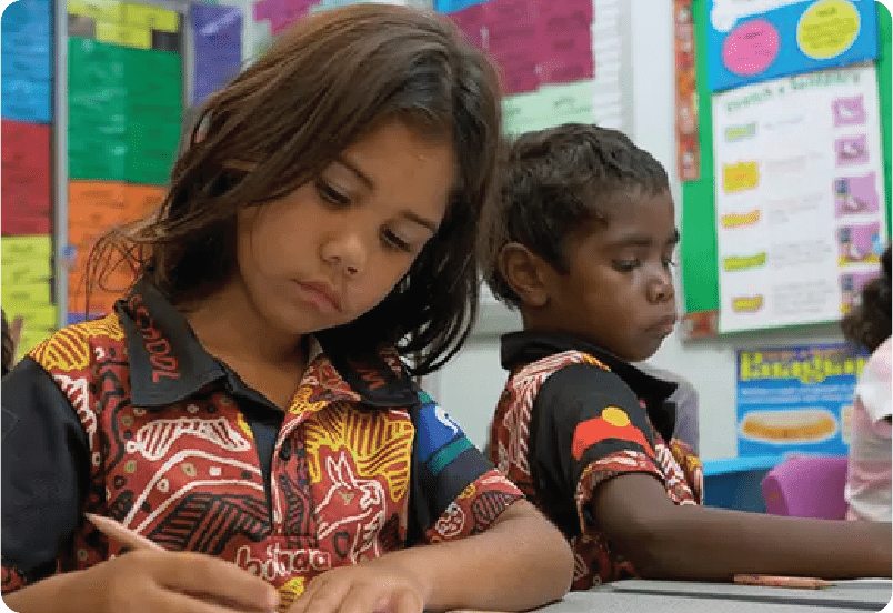 Two children working in a classroom