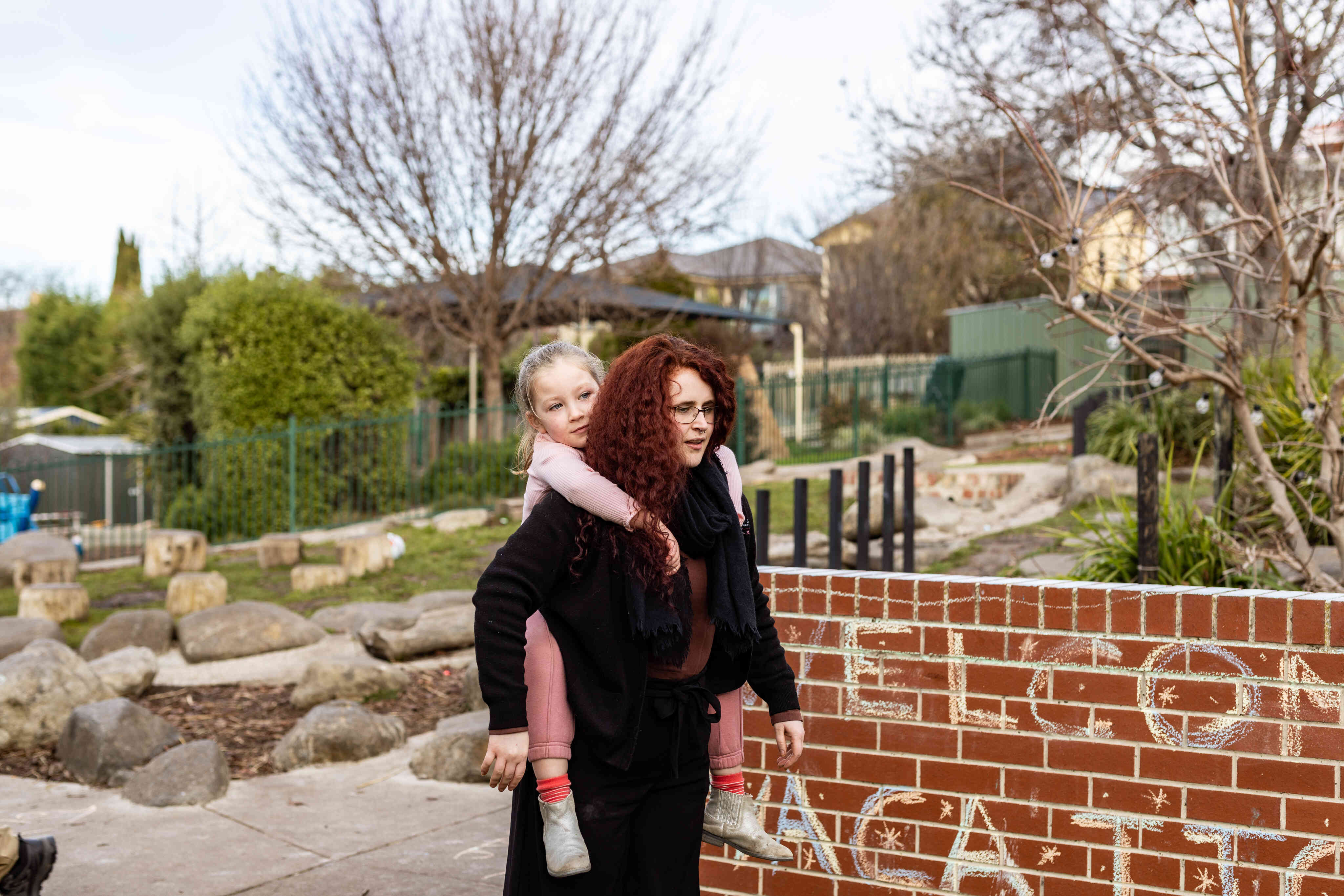 An educator walks with a child